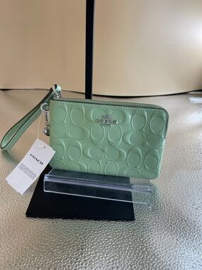 Coach Seafoam Green Embossed C Wristlet New with limited Charm